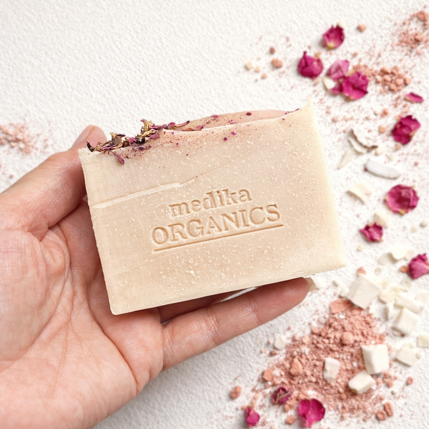 A handcrafted rose soap with pink clay made with natural ingredients and pure essential oils for a gentle, everyday cleanse.