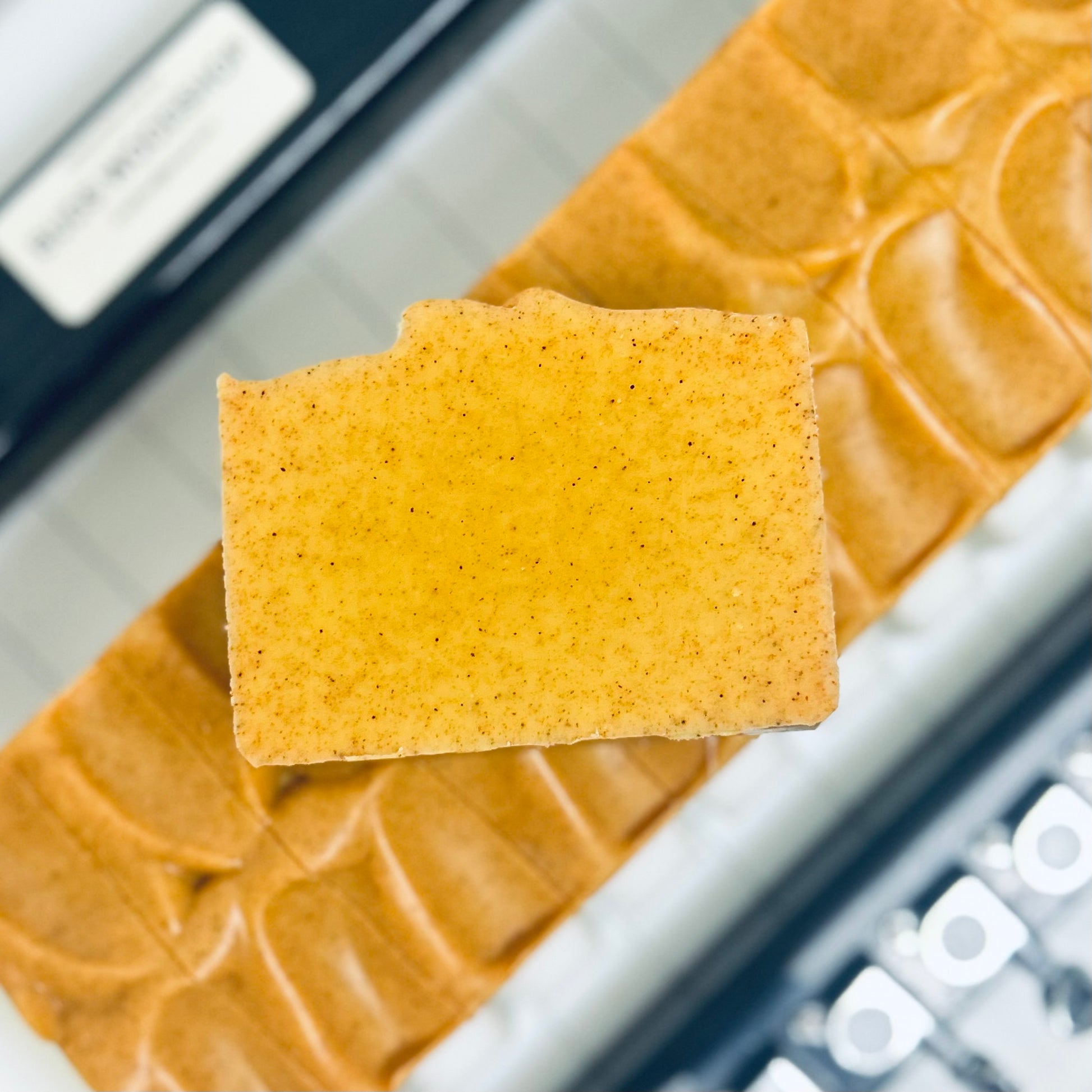 Turmeric soaps on soap cutter