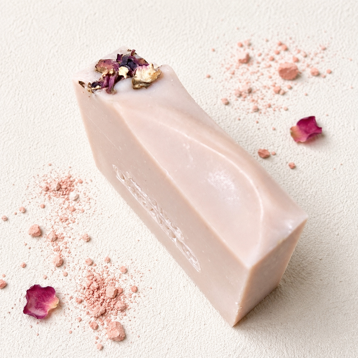 Coconut Rose olive oil soap bar with dried rose petals.
