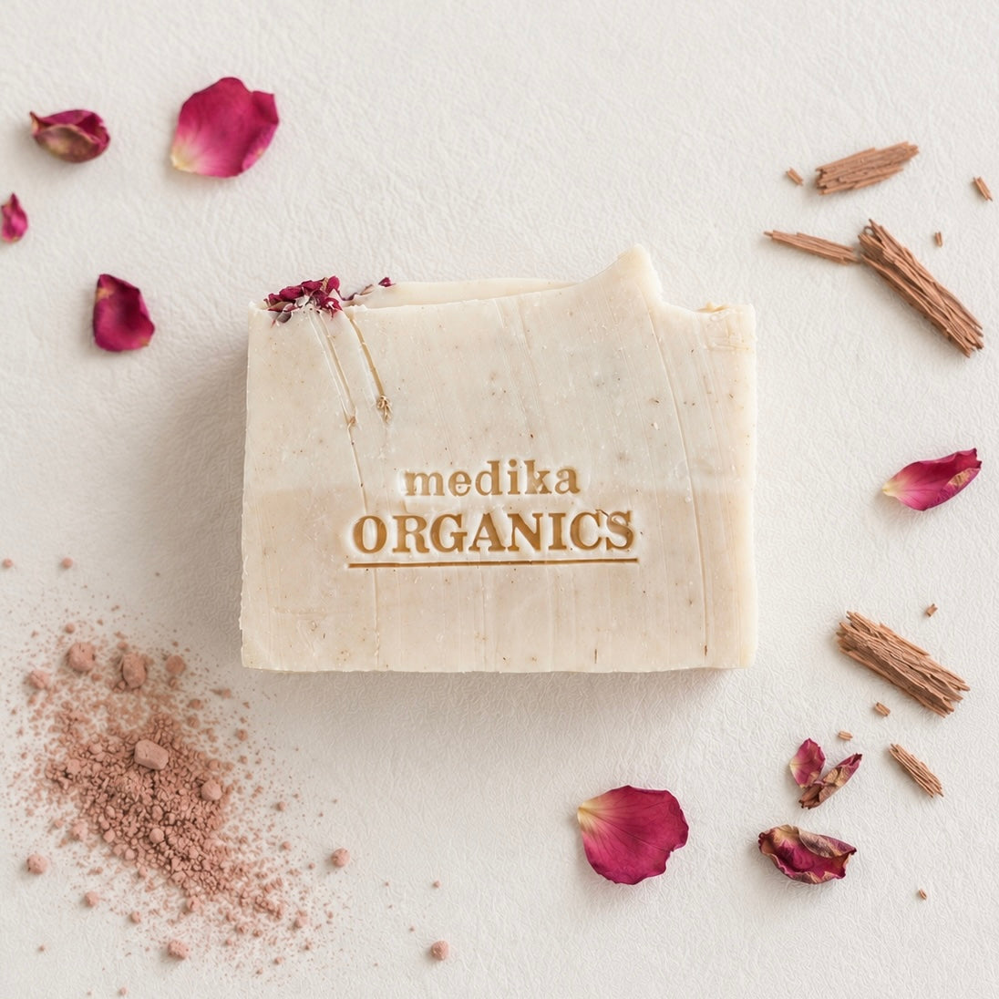 Handmade rose scented soap bar with rose geranium and cedarwood.